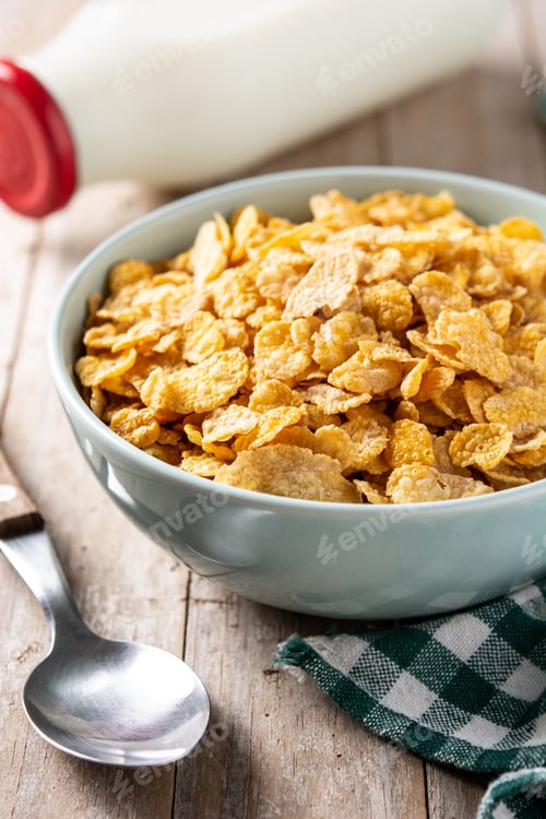 Preview: Corn flakes in a blue bowl and milk bottle