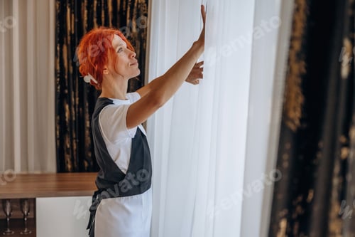 Preview: Maid is working in modern hotel room