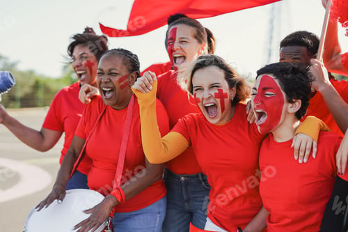 Preview: Multi generational people having fun screaming outside of football stadium