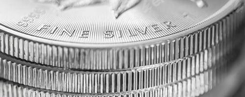 Preview: Closeup shot of silver coins on top of each other
