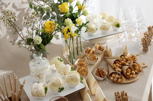 Preview: Tasty treats on table in room. Sweet buffet