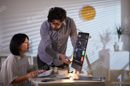 Preview: Business people working with financial charts