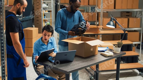 Preview: Business owners working on shipping products in warehouse