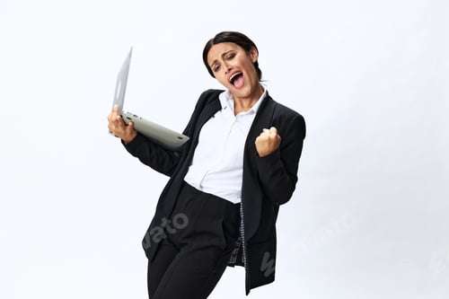 Preview: Business woman with laptop in hand in black business suit shows signals gestures and emotions on