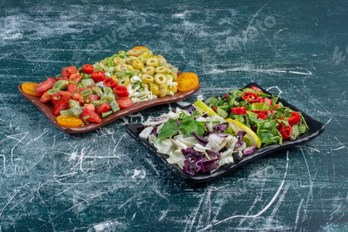 Preview: Green salad with chopped lettuce, purple cabbages, chili pepper and tomatoes