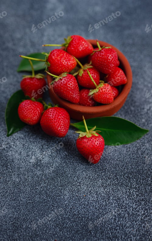 Preview: Fresh organic strawberries , over dark background