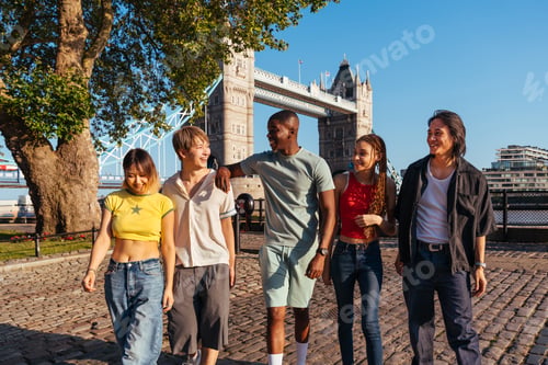 Preview: Multiracial group of happy young friends bonding in London