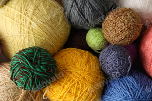 Preview: Balls of yarn all over background, closeup