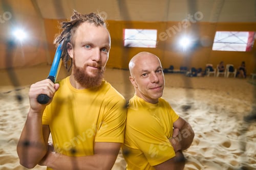 Preview: Two men stand half-turned to each other during sports game
