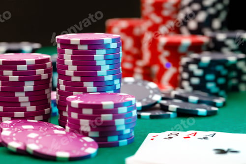 Preview: Playing cards and chips on green casino table background
