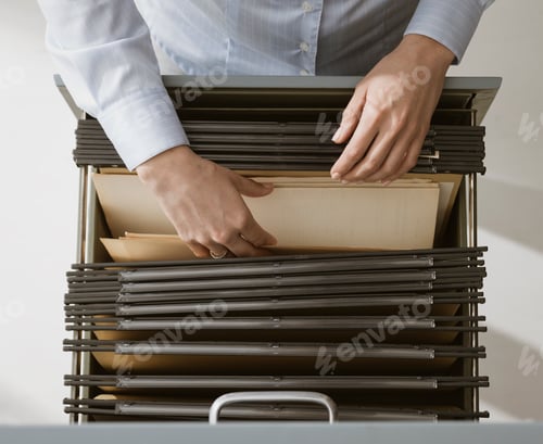 Preview: Office worker searching files in the archive