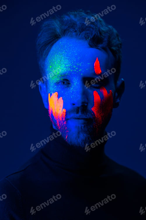Preview: Caucasian male model with blacklight paint.