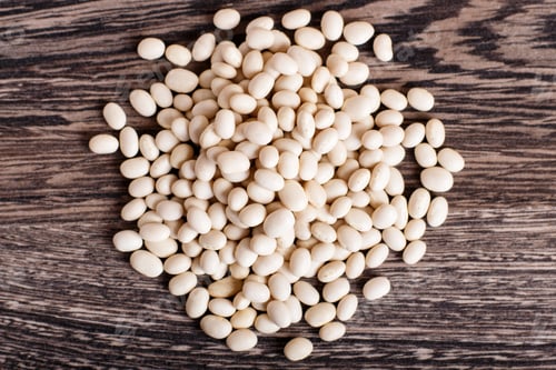 Preview: Pile of white beans isolated on a gray wooden background.