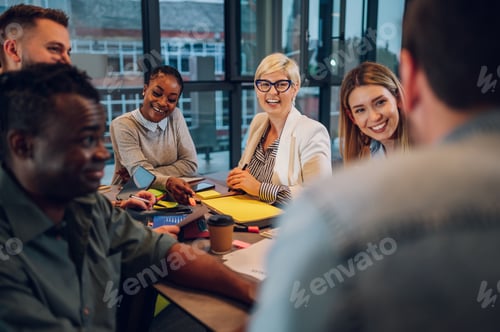 Preview: Multiracial business team working together and having a meeting in the office