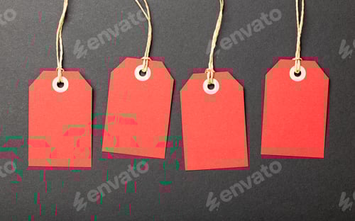 Preview: Red Sale Tags on Dark Background Close Up
