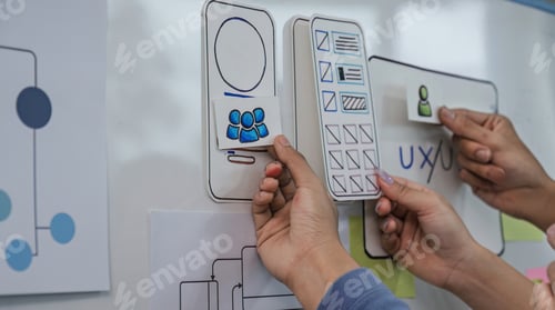 Preview: Close up ux developer and ui designer brainstorming interface wireframe design.Creative digital