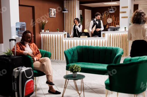 Preview: Asian receptionist taking booking call