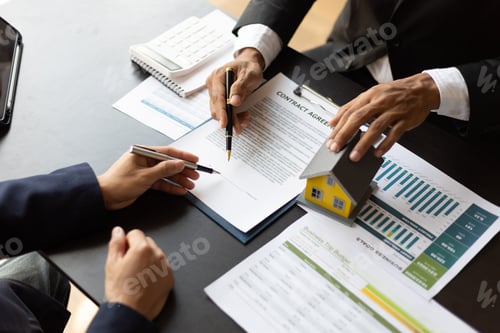 Preview: Real estate agents and business people discuss signing a home purchase agreement and home insurance.