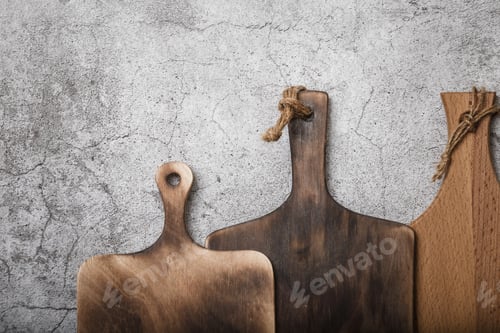 Preview: Samples of Three Different Rustic Wooden Cutting Boards on a Kitchen Countertop