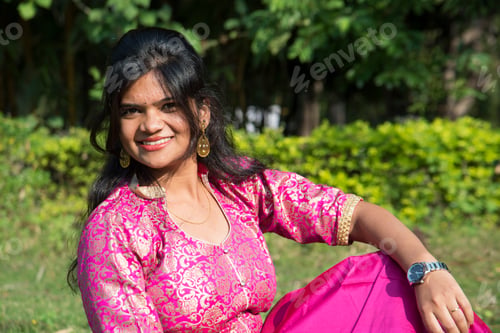 Preview: Outdoor portrait of beautiful young Indian girl in the park