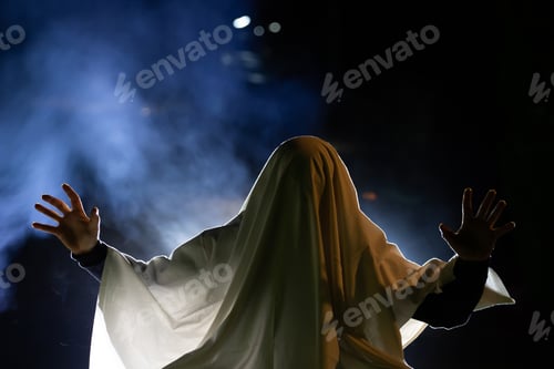 Preview: Halloween concept with ghost on a foggy night.