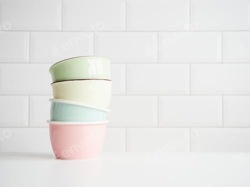 Preview: several pastel-colored ceramic bowls stacked on the table