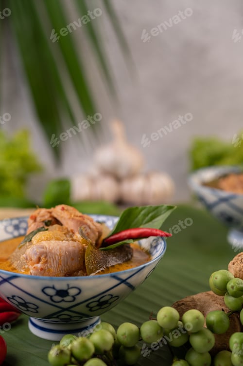 Preview: Chicken curry with Wax gourd in a ceramic cup.