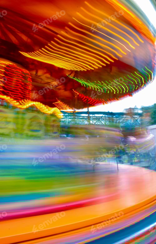 Preview: Motion Blur of Colorful Merry-Go-Round at Amusement Park