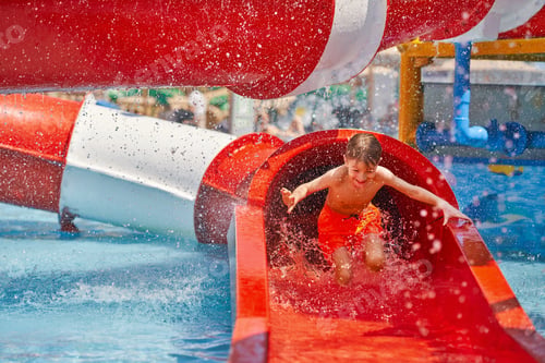 Preview: Picture of young boy playing in outdoor aqua park