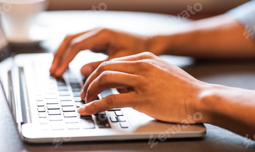 Preview: Male hands typing text or programming code on laptop