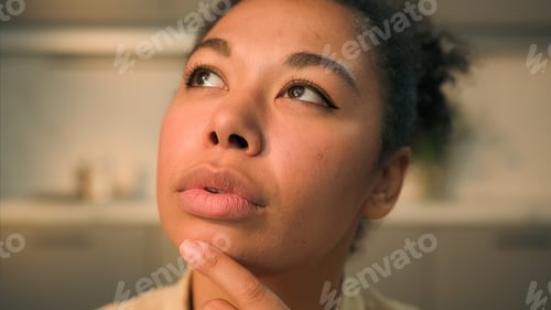 Preview: Close up female portrait African American woman girl mother wife homeowner thoughtful pensive