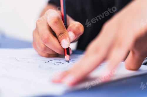 Preview: Caucasian woman writing and drawing in a notebook with a pencil