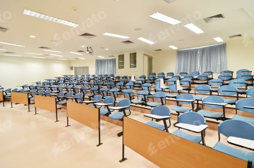 Preview: Empty Lecture Hall with Blue Seating and Lighting