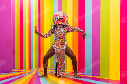 Preview: Beautiful young woman dancing and having fun inside a rainbow box room