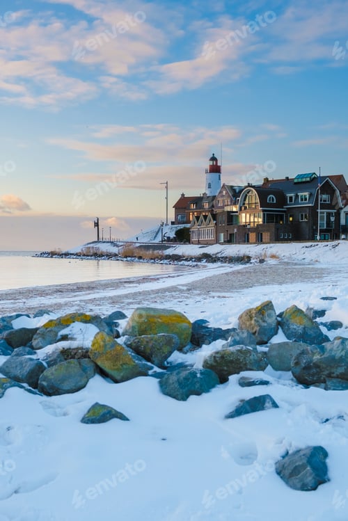 Preview: Lighthouse of Urk during winter with snow in the Netherlands