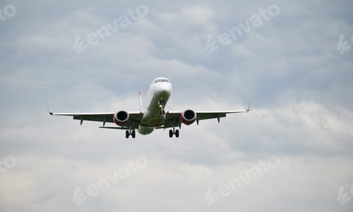 Preview: Commercial airplane flying in the sky.