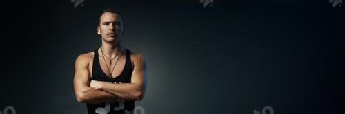 Preview: Confident Man Portrait on Dark Wide Banner with Copy Space
