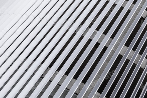 Preview: Light gray grill, grid surface on corrugated object made of steel.
