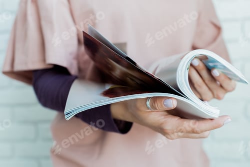 Preview: woman reading a magazine