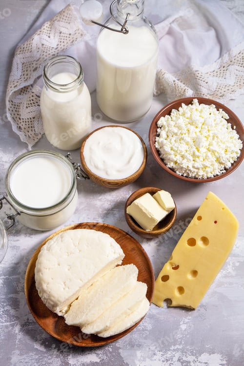 Preview: Set of different dairy products (milk, sour cream, cottage cheese, yogurt and butter).