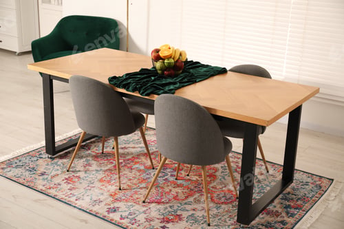Preview: Bowl of fruits on wooden table in dining room. Interior design