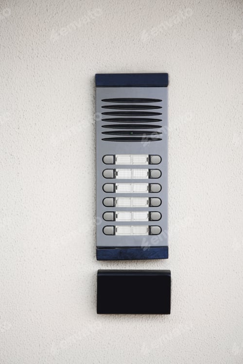 Preview: Modern intercom on beige wall. Security system