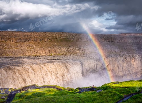 Preview: Dettifoss waterfall and rainbow, Iceland. Famous place in Iceland. A mountain valley and clouds afte