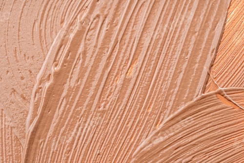 Preview: Background of a smudged cream foundation texture