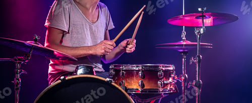 Preview: The drummer plays the drums.