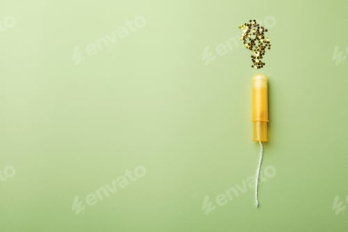 Preview: Fresh tampon and glitter on green background
