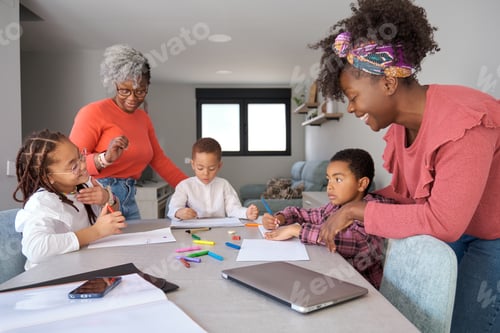 Preview: African mothers painting with their children during the freetime.