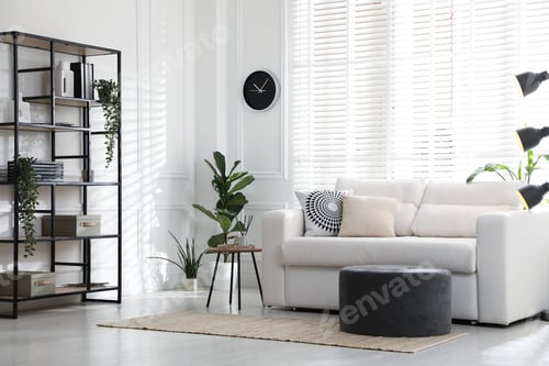 Preview: Stylish shelving unit with decor and sofa in room