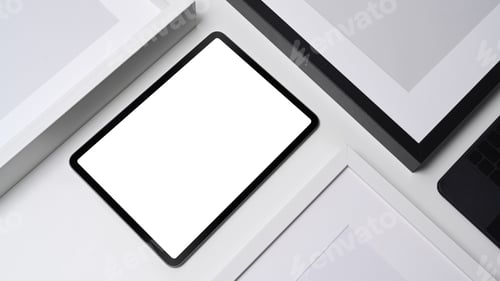 Preview: Flat lay, mock up digital tablet and empty picture frames on white background.