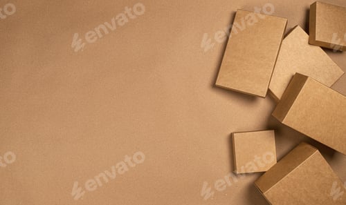 Preview: Brown cardboard boxes on craft paper background, top view
